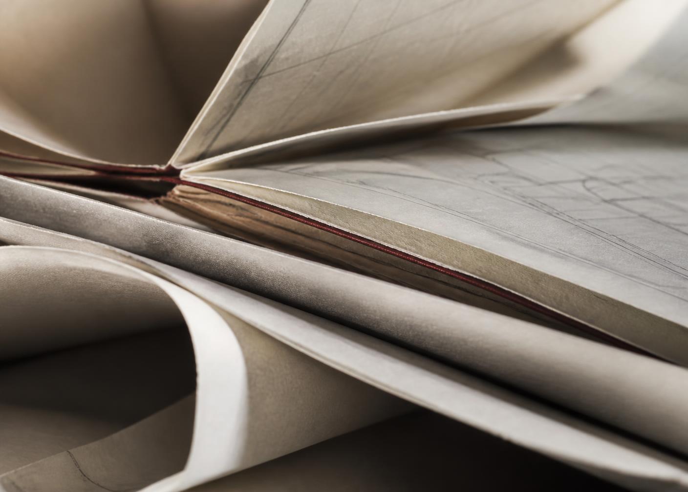 Layered research documents with a single red edge
